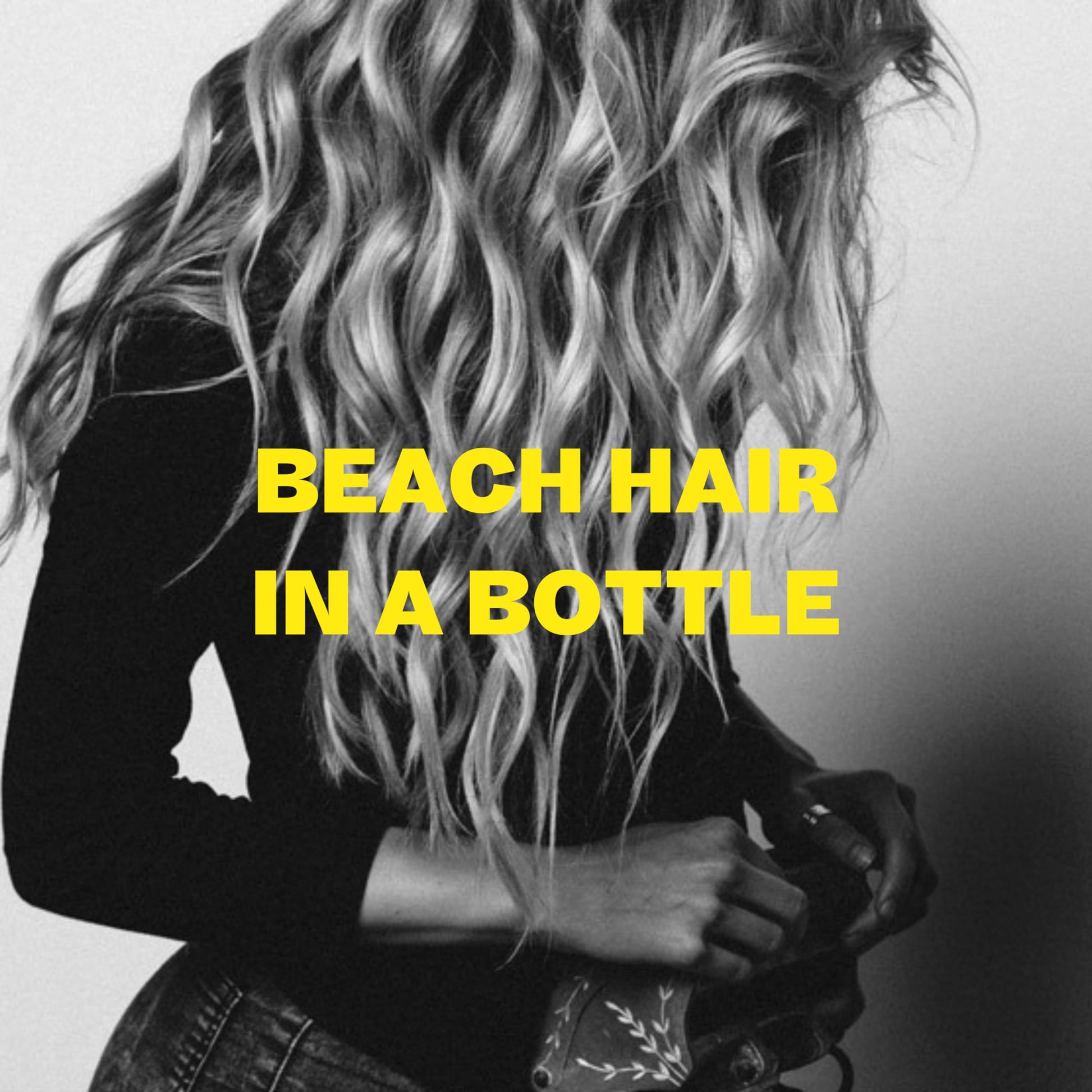 Lifestyle shot showing beach wave hair result with Byrd spray