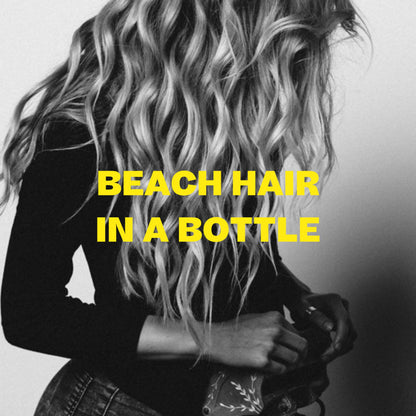 Lifestyle shot showing beach wave hair result with Byrd spray