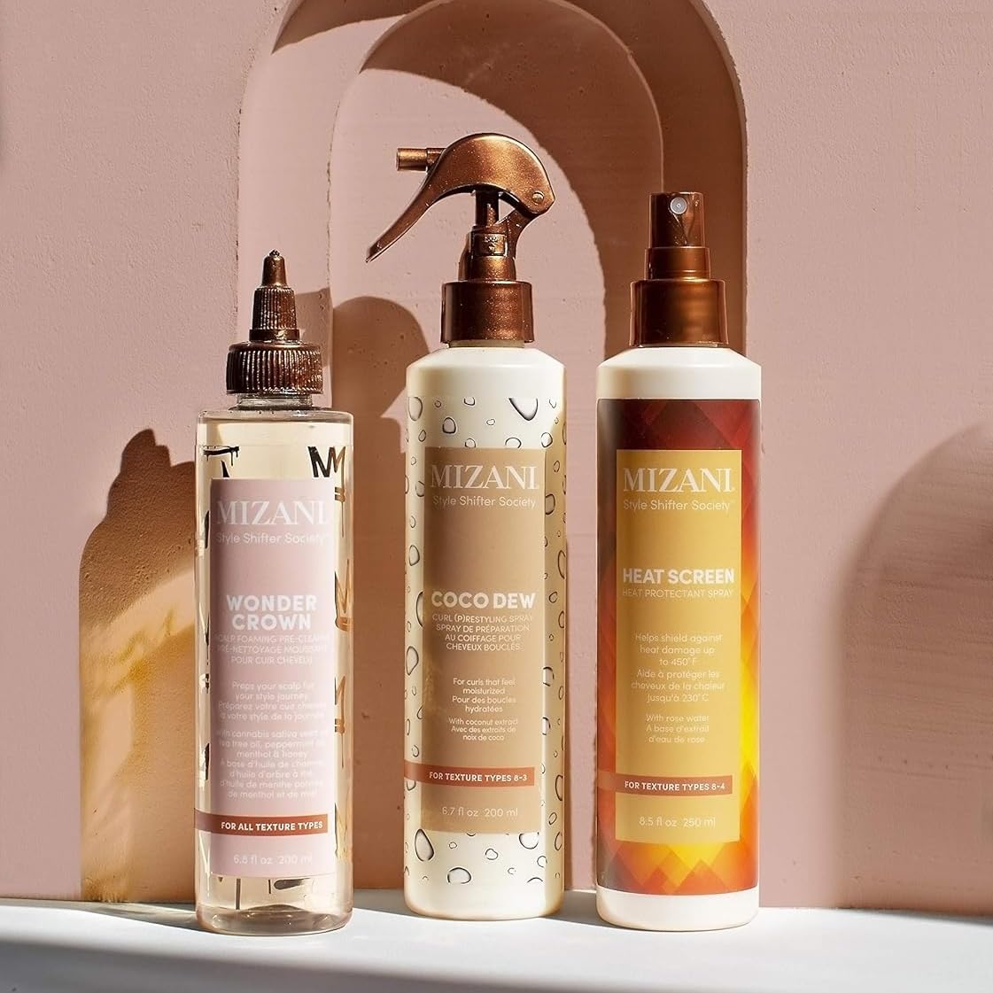 Application of Mizani Heat Screen on curly hair