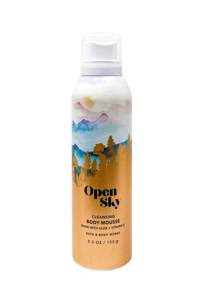 Two bottles of Open Sky foaming shower mousse showing aloe and vitamin E ingredient details on the label