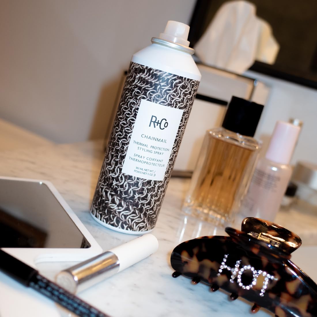 Back label of R+Co Chainmail hair styling product