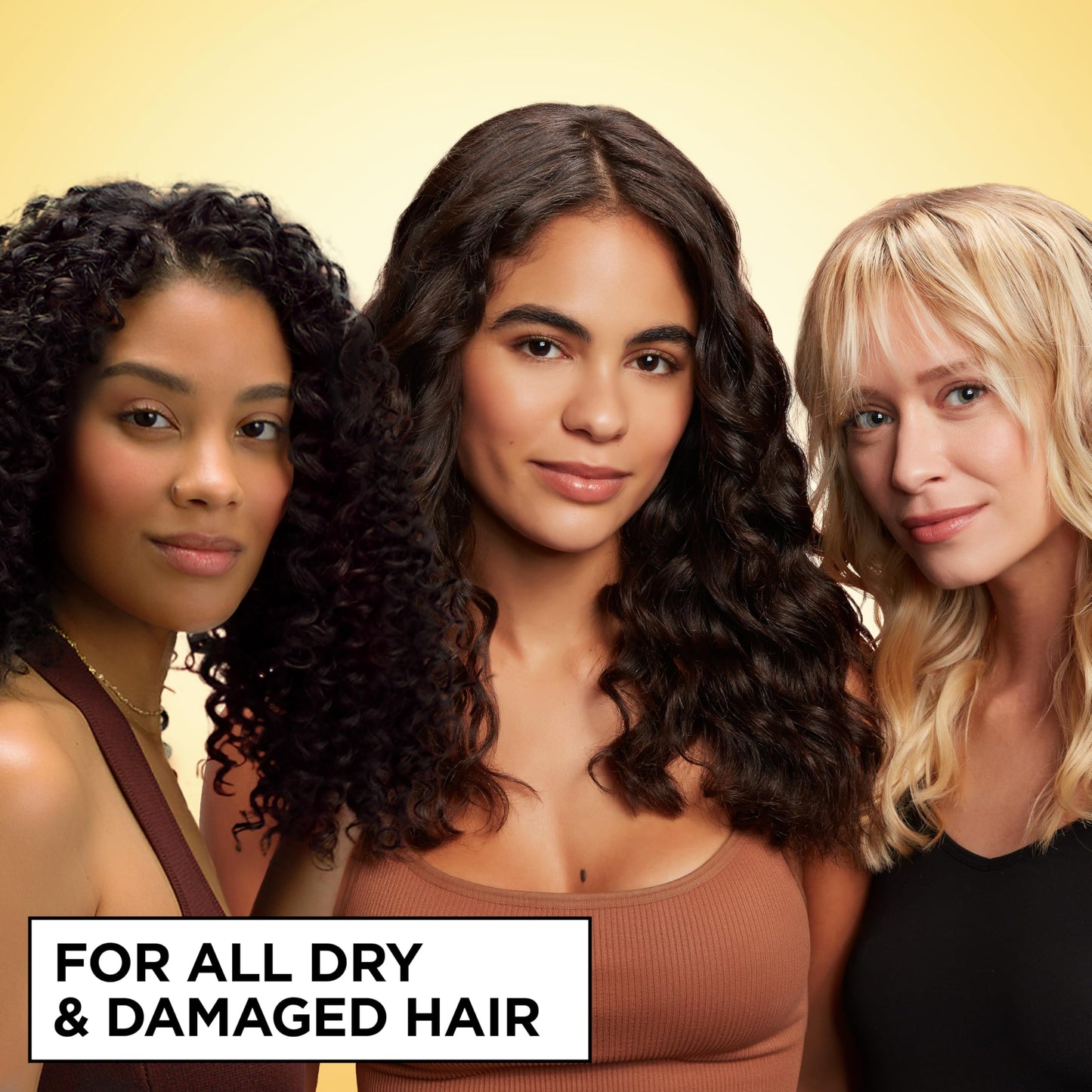 Garnier heat protectant spray being applied to damp hair
