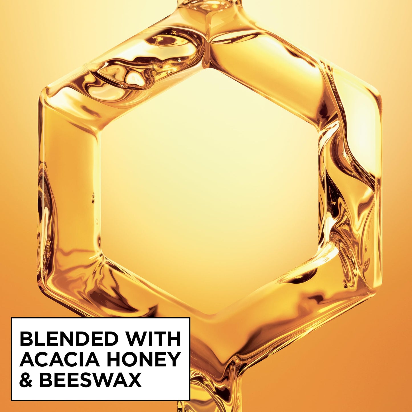 Texture and spray nozzle detail of Garnier Hair Honey Milk