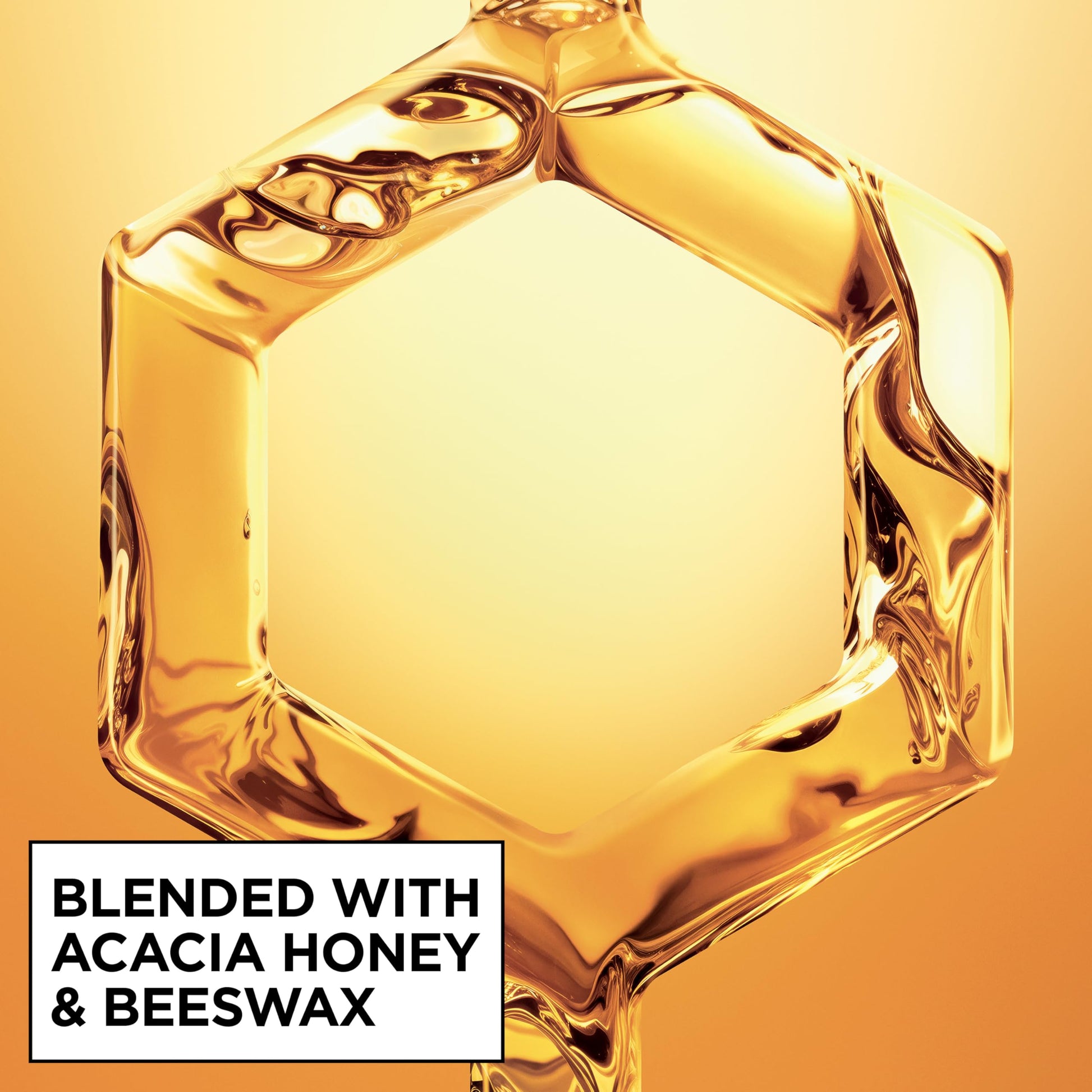 Texture and spray nozzle detail of Garnier Hair Honey Milk