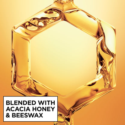 Texture and spray nozzle detail of Garnier Hair Honey Milk