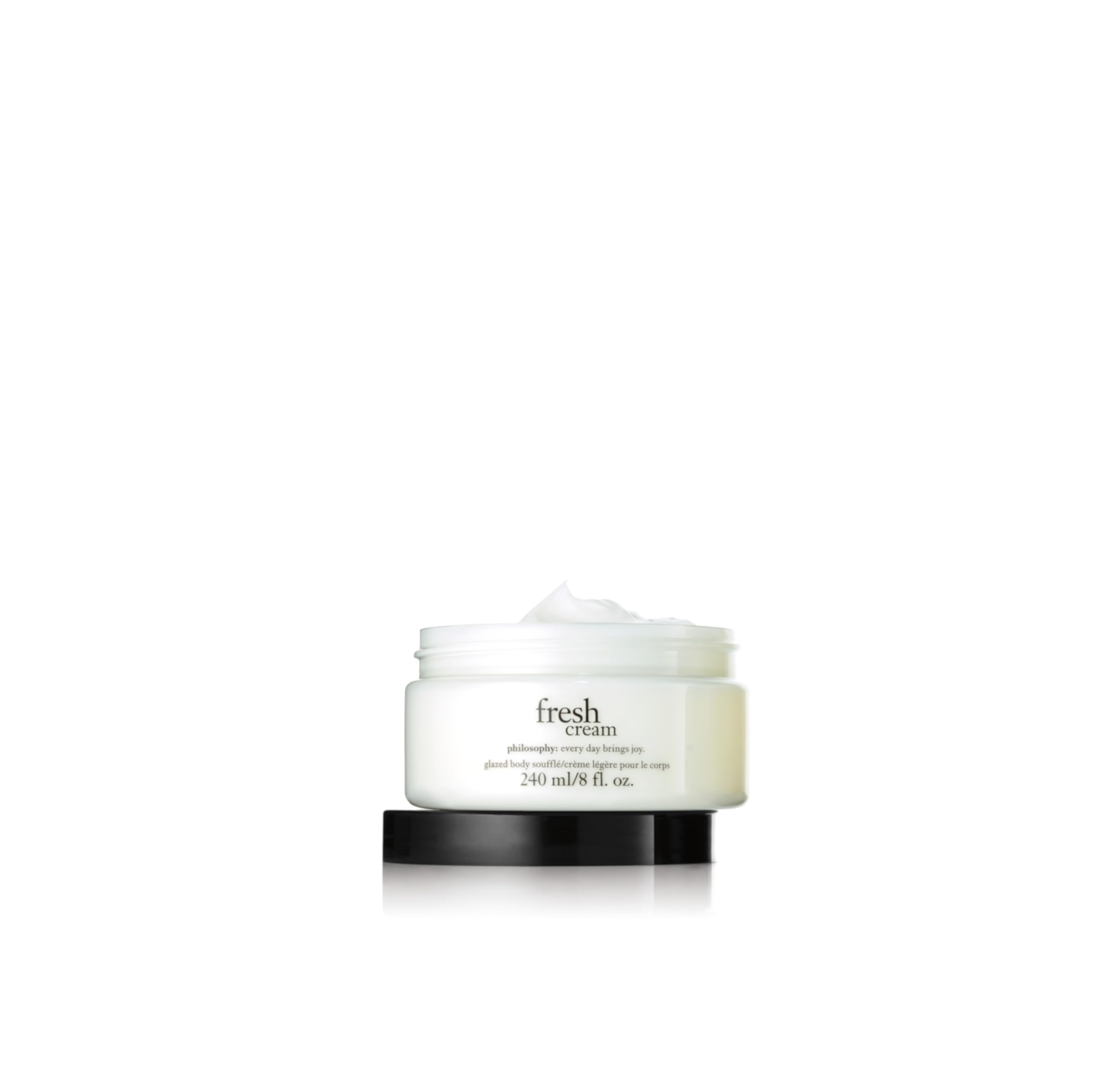 Luxury whipped body cream texture showing lightweight moisturizing consistency.