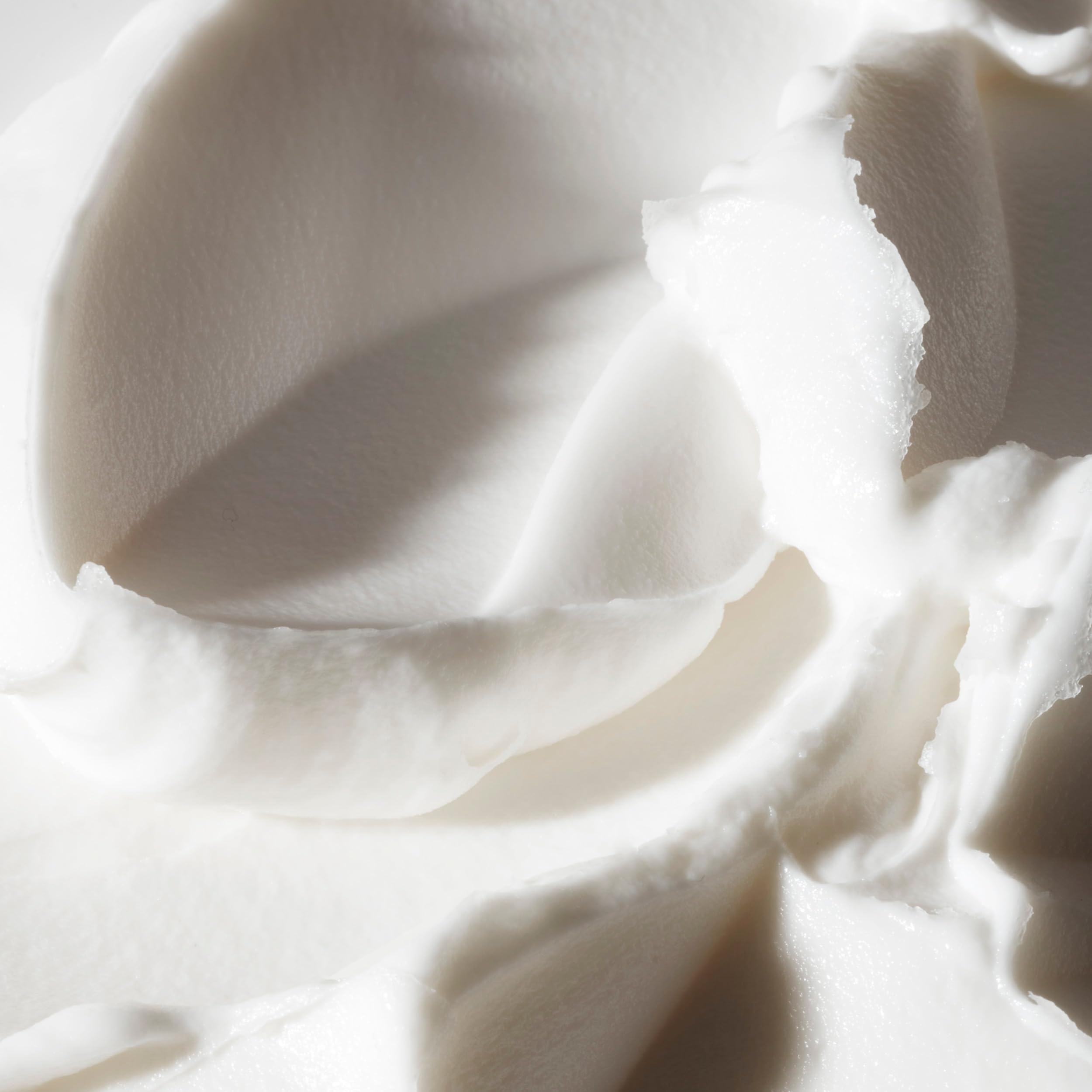 Philosophy holiday scented whipped body cream container showing texture detail and branding labels