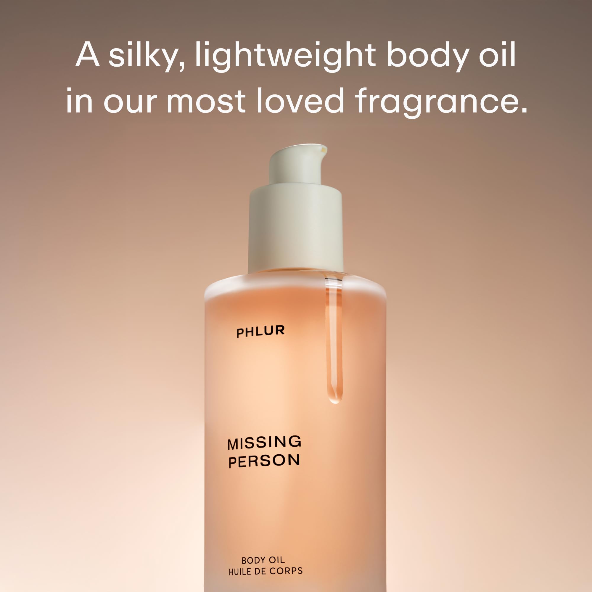 Close up of Phlur Missing Person Body Oil packaging and branding