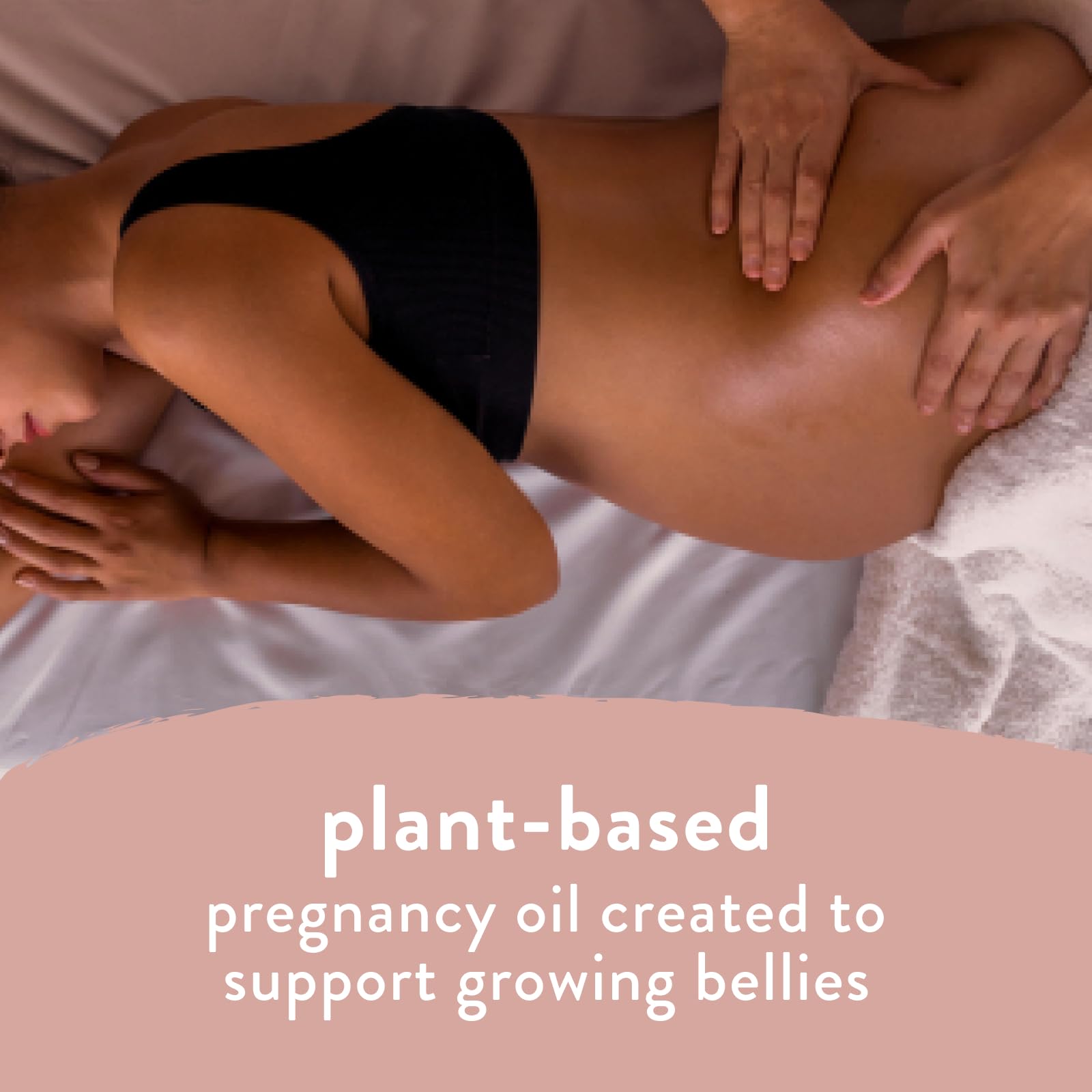 The Honest Company Mama belly oil bottle with plant-based ingredients label