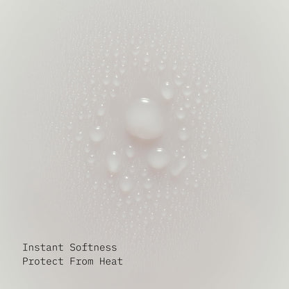 AG Care thermal protectant spray protecting hair from heat styling damage.