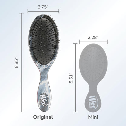Back profile showcasing the sophisticated metallic marble pattern of the hair brush.