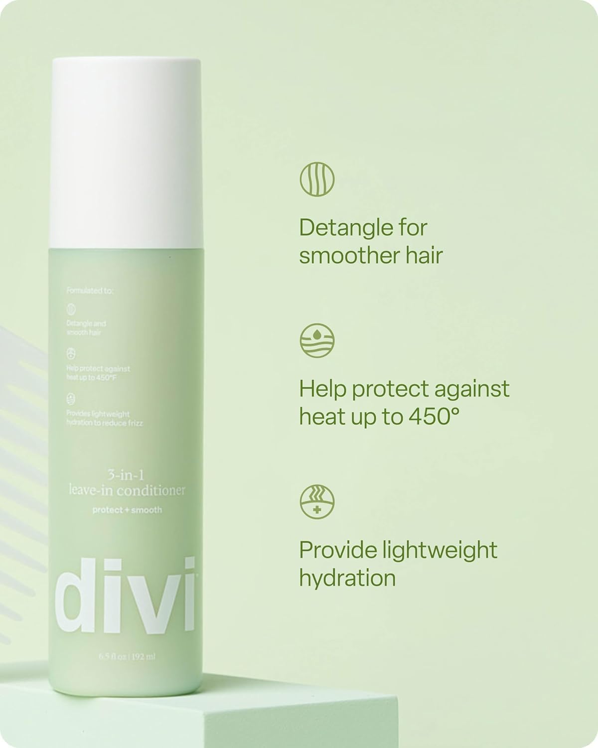 Lightweight mist texture of Divi hair protectant spray on a clean background.