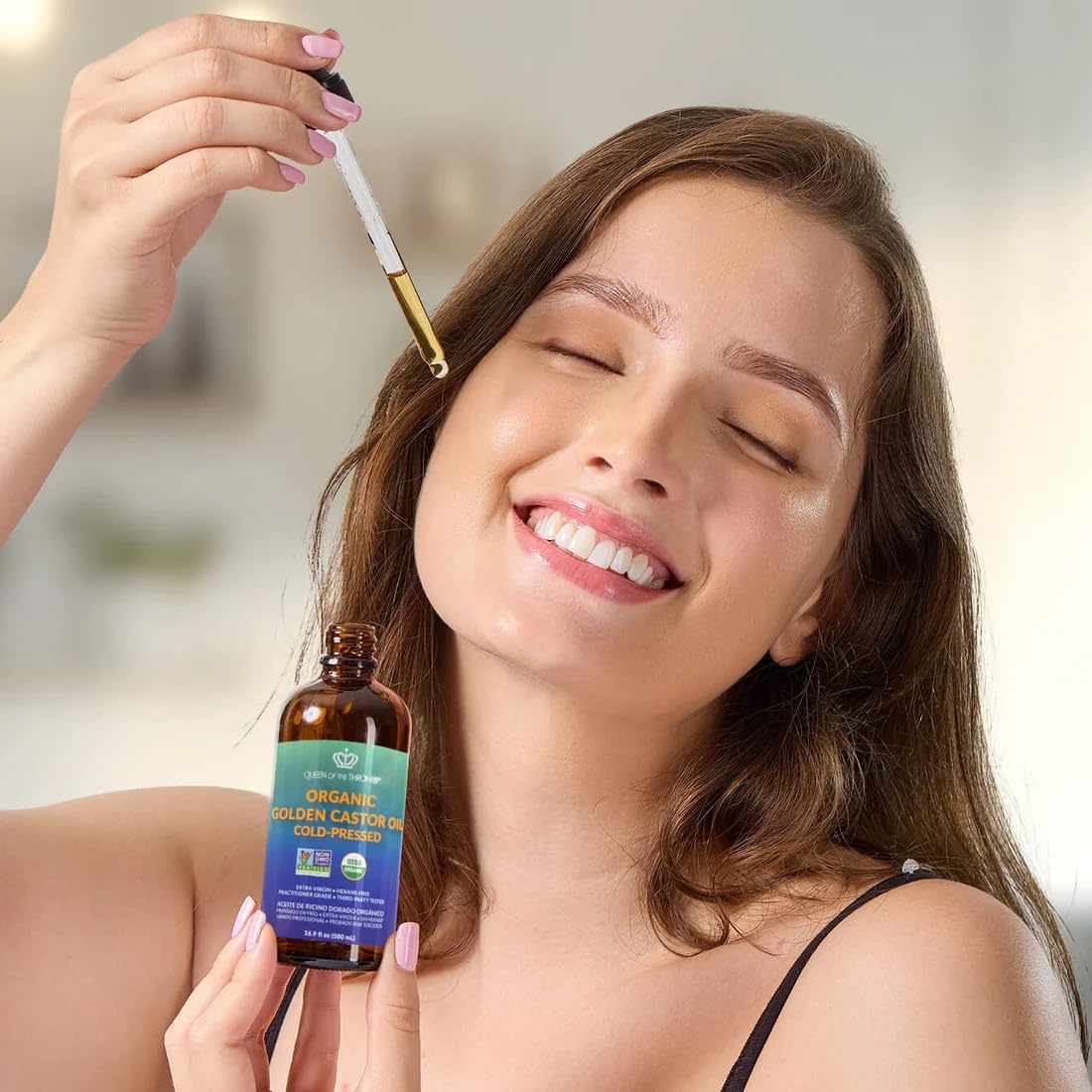 Queen of the Thrones castor oil in amber glass bottle
