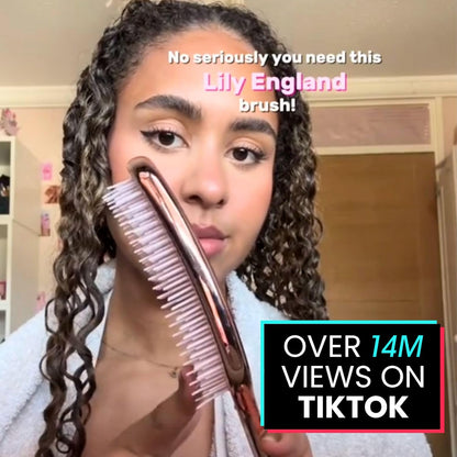 Lily England detangler brush side profile showcasing sleek rose gold finish.