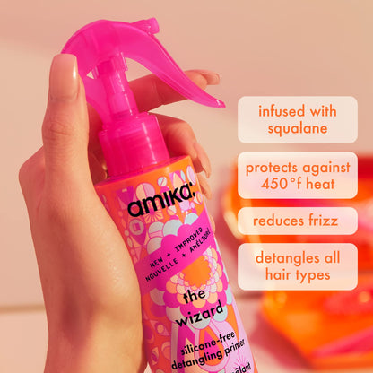 Amika detangling heat protectant spray being held to showcase bottle dimensions