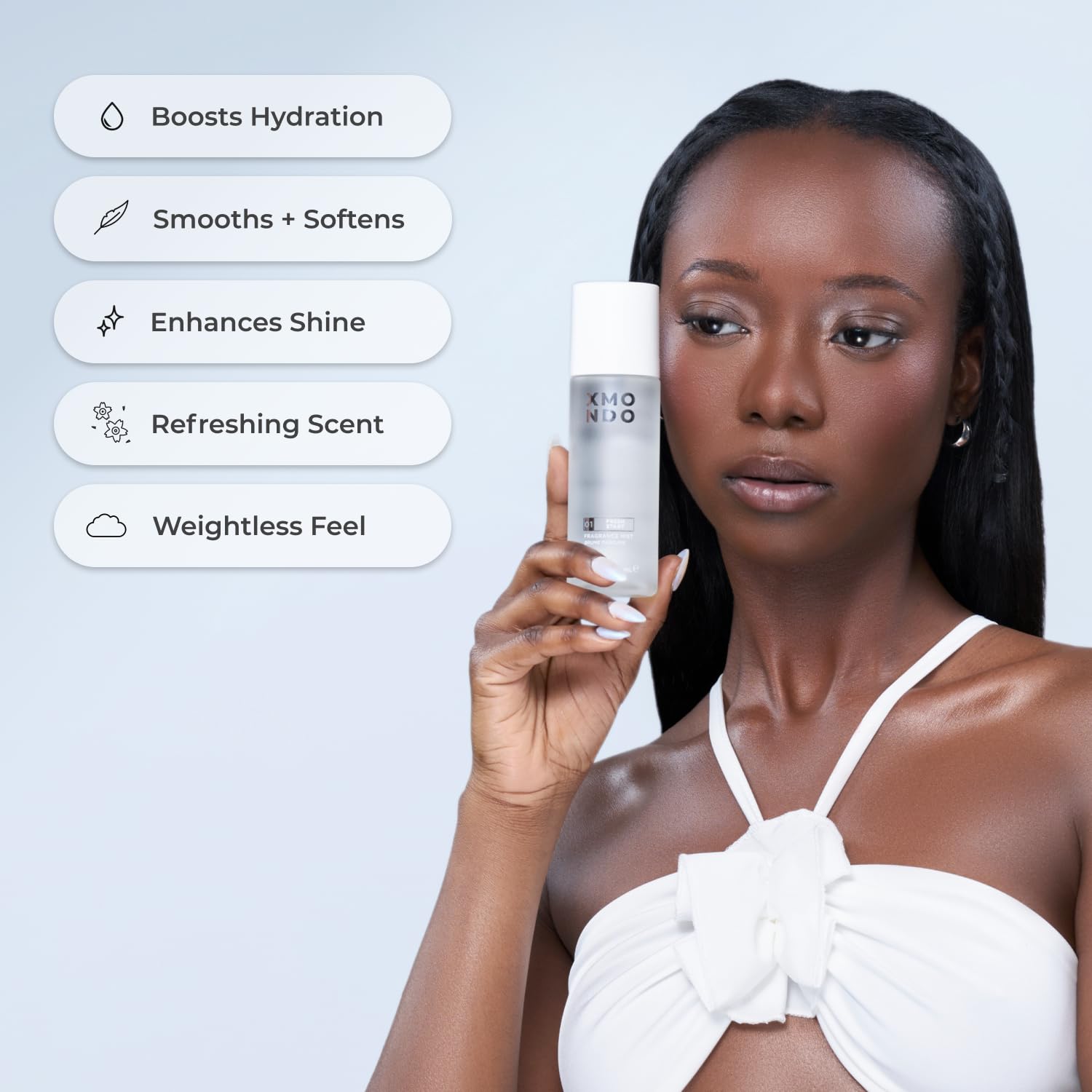 Application of XMONDO fragrance mist on hair
