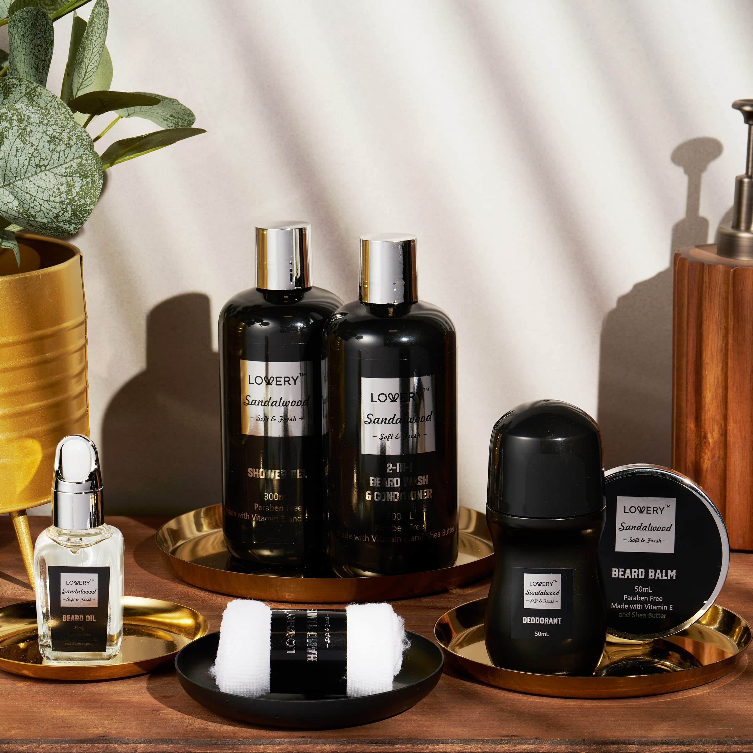 The complete eleven piece Lovery luxury beard kit arranged neatly outside its decorative miniature bathtub packaging.