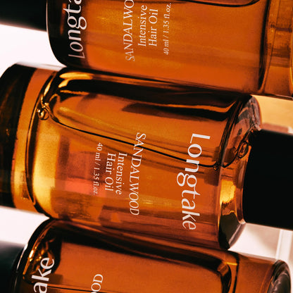 Lifestyle shot of Longtake sandalwood perfume hair oil
