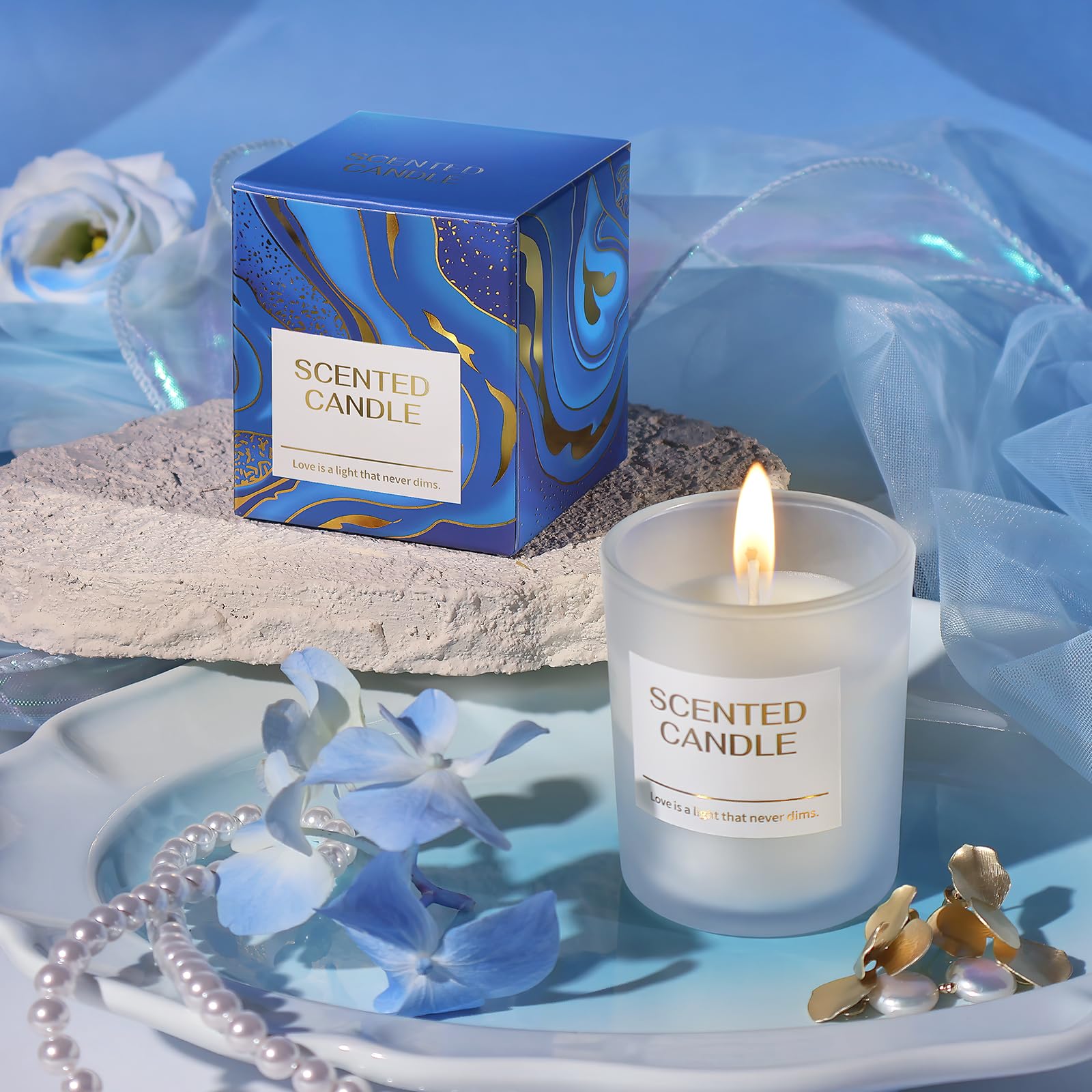 Larierour dried flower greeting card alongside the luxury gold accented packaging box