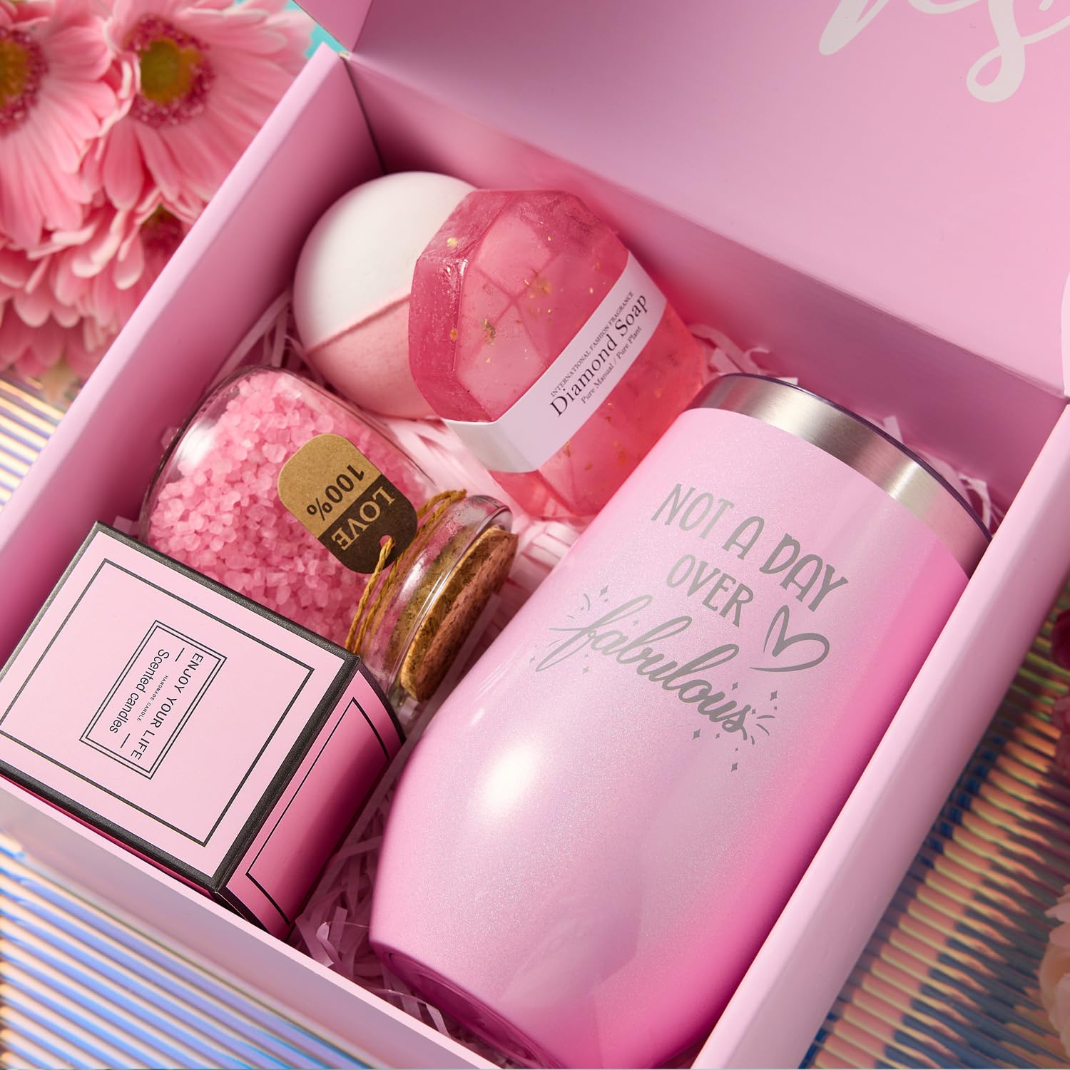 Maddify rose scented handmade soy wax candle next to a diamond shaped artisan bath soap.