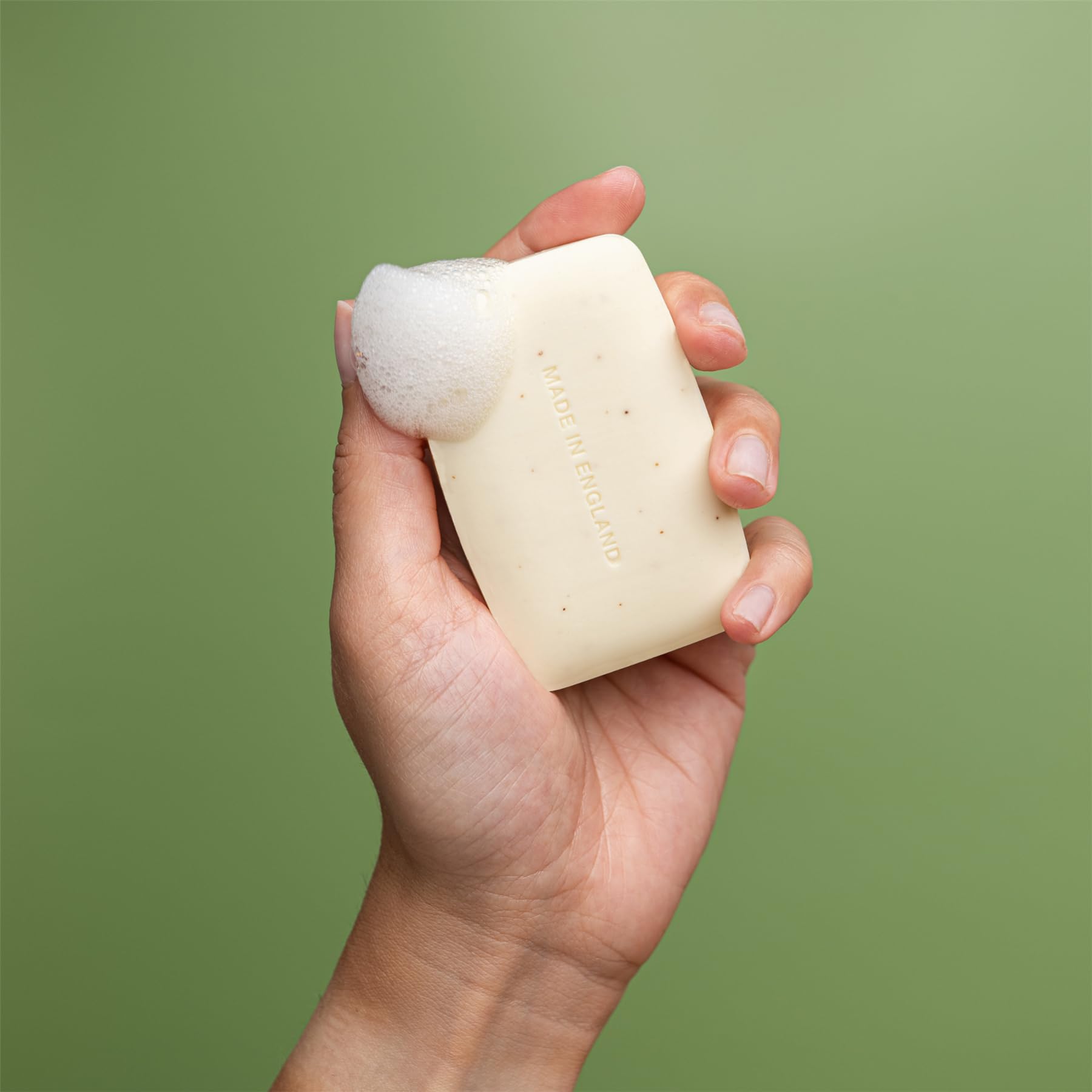 Close up shot of the imported REVITALE exfoliating bar showing the pure vegetable base logo
