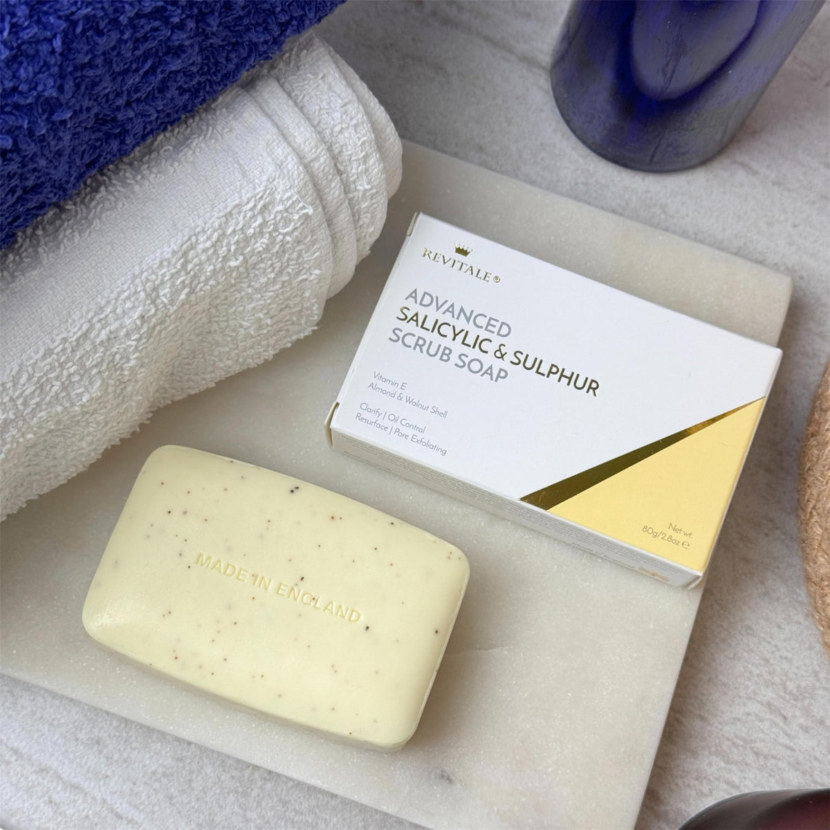 Close-up of Revitale bar soap lather and natural scrub particles