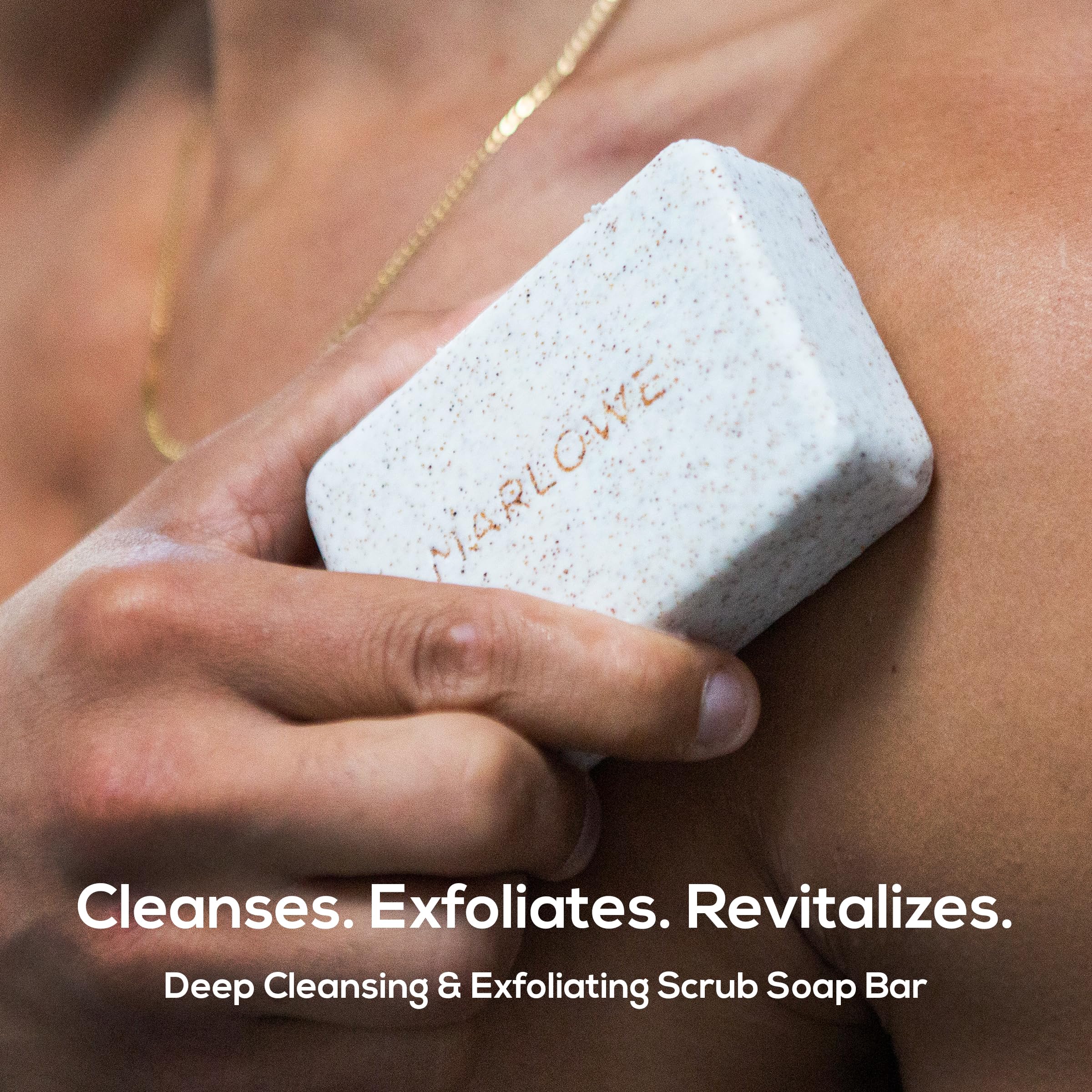 MARLOWE. Number 102 men's exfoliating bar soap showing the texture of the pumice and apricot seed powder.