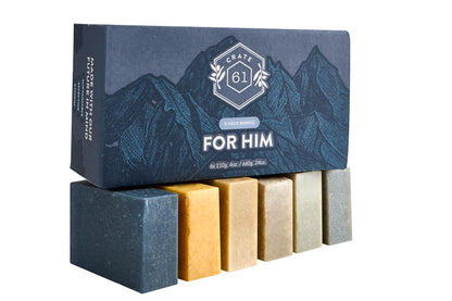 Six natural handmade soap bars showing unique textures of Alpine Spice, Eucalyptus Mint, and Charcoal.