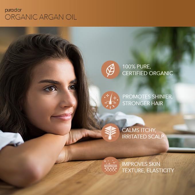 PURA D'OR 100% pure cold pressed virgin grade argan oil pump dispenser bottle on a clean background