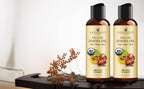 Handcraft Blends 4 fluid ounce organic jojoba oil bottle held to demonstrate size and texture.