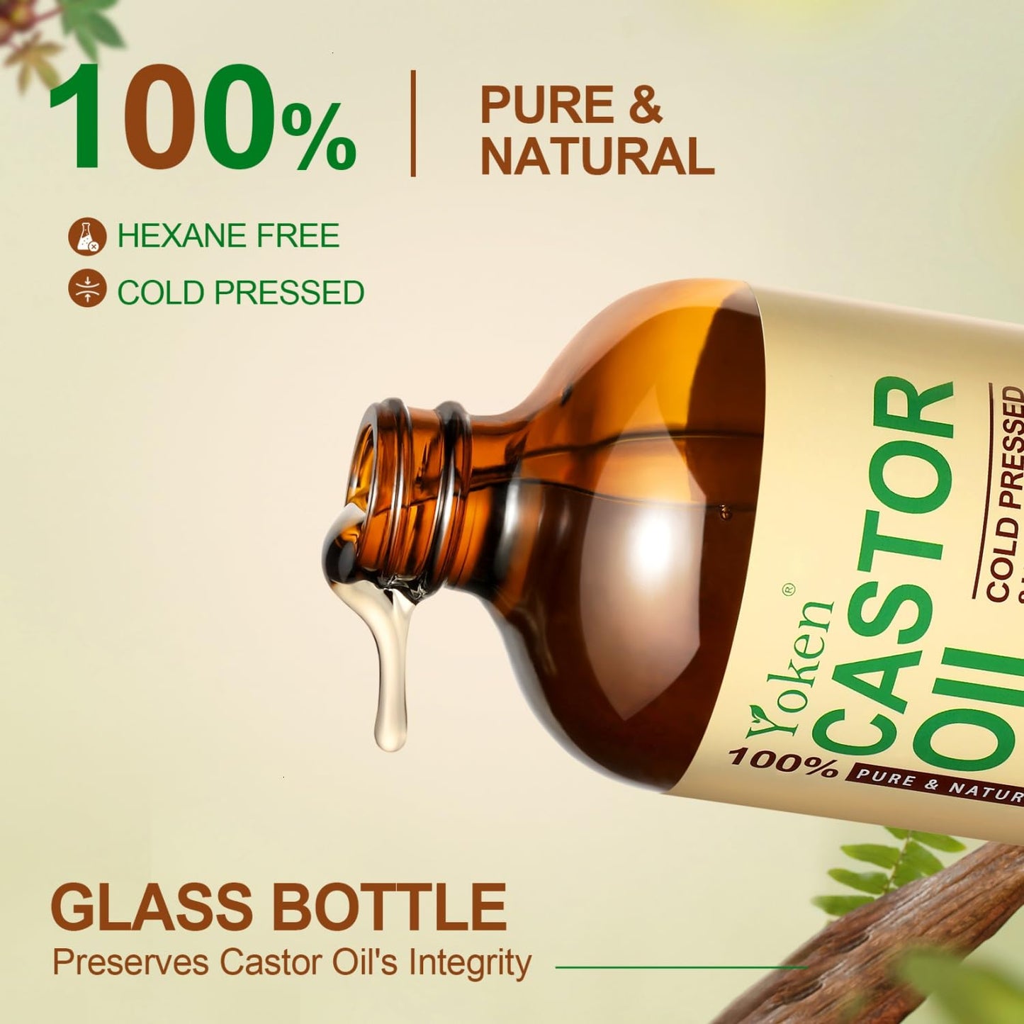 Yoken cold pressed castor oil bottle alongside a dropper displaying its rich clear golden consistency for hair care.