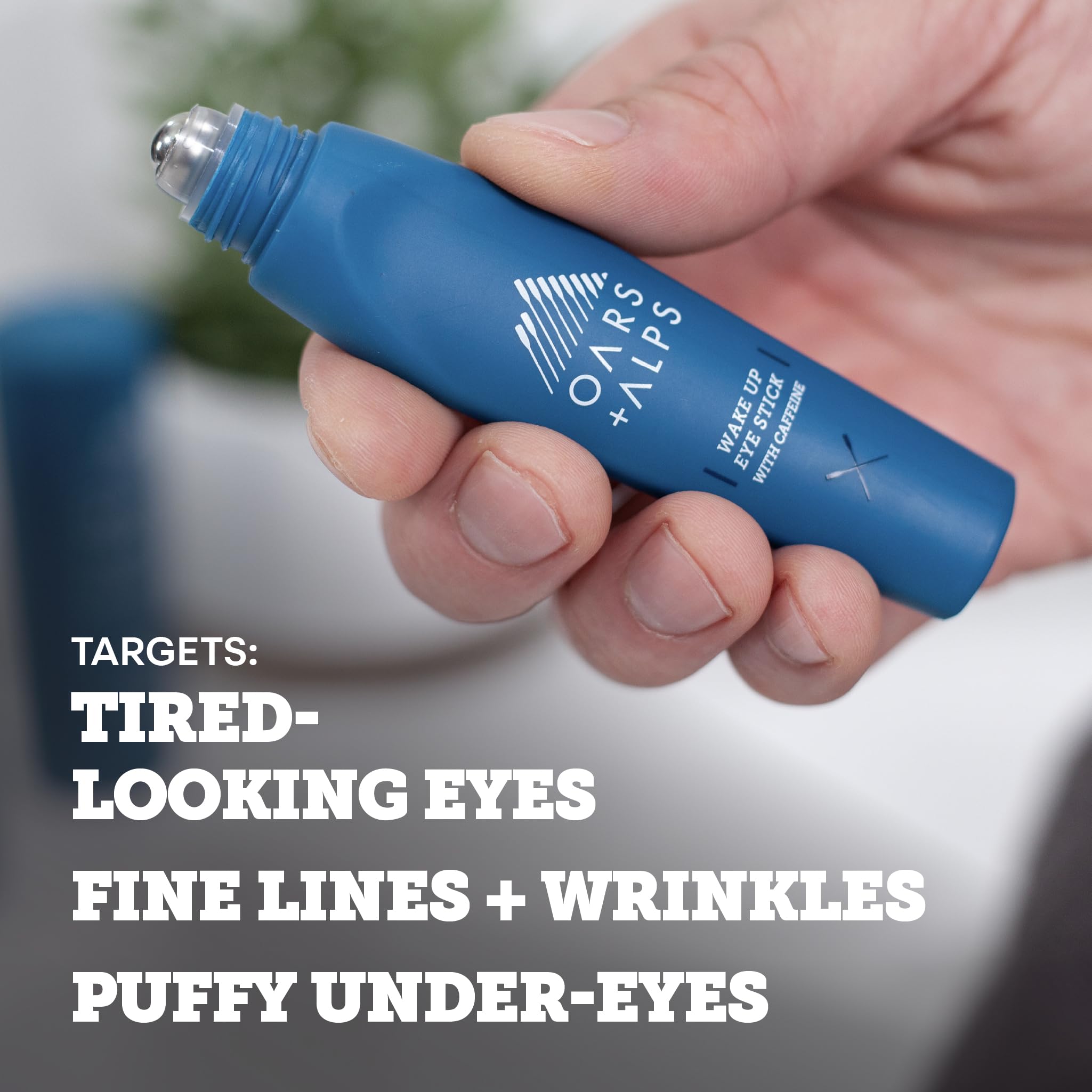 Oars + Alps under eye depuffer being rolled onto the skin for puffiness reduction.