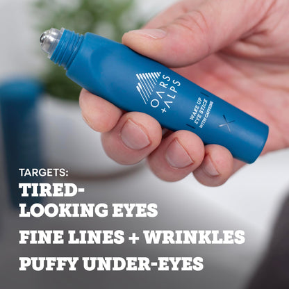 Oars + Alps under eye depuffer being rolled onto the skin for puffiness reduction.