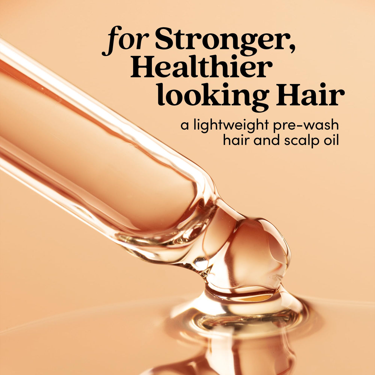 Fable and Mane HoliRoots strengthening serum dropper placing oil onto hands