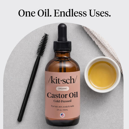 Two ounce glass bottle of Kitsch organic hair oil for women