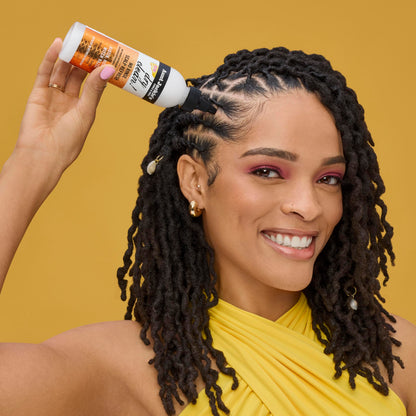 Side view of Aunt Jackie's 6 fluid ounce scalp cleanser bottle