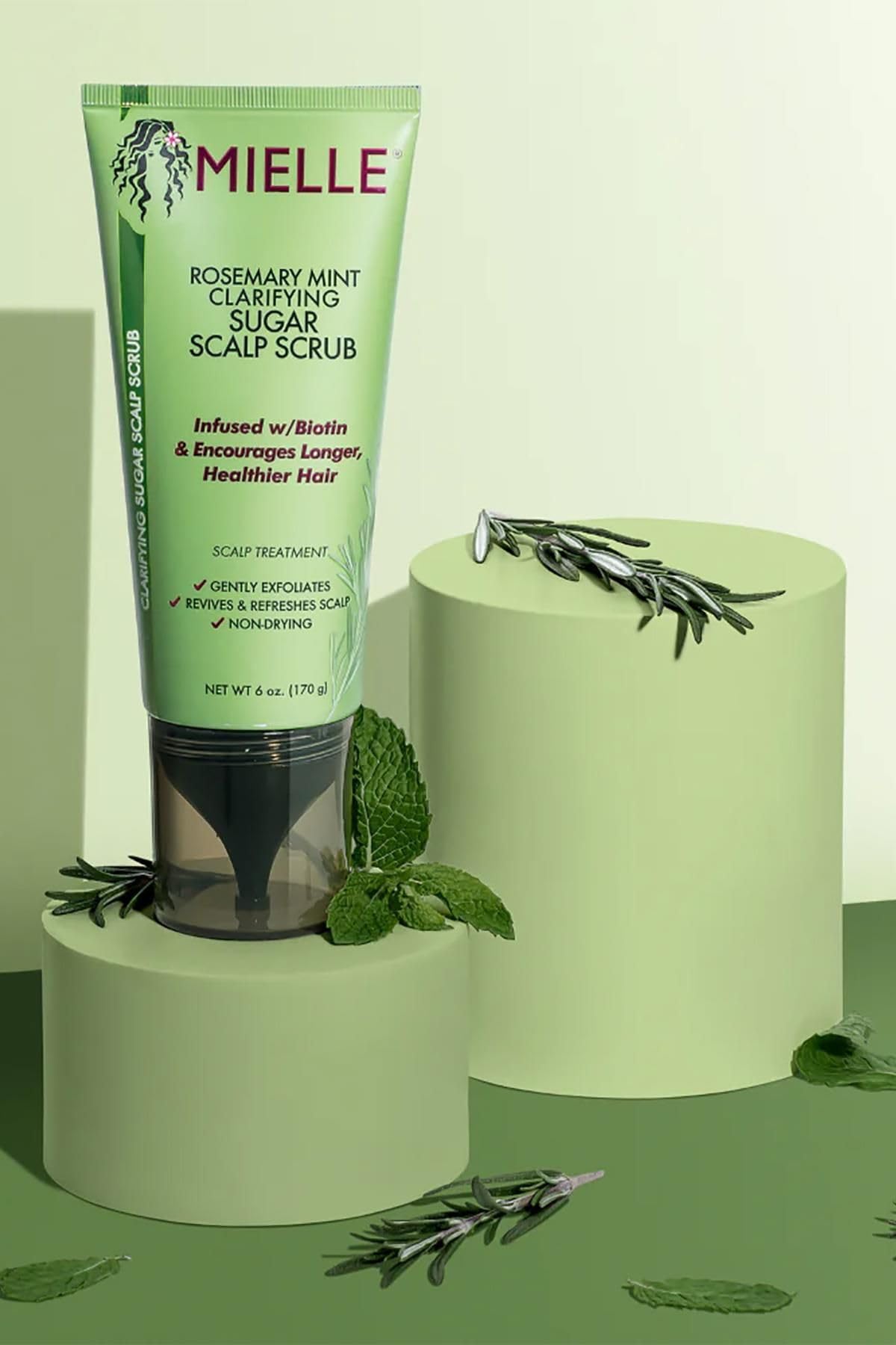 Application demonstration of Mielle Organics scalp scrub on hair