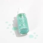 Derma E hair and scalp serum bottle next to outer carton