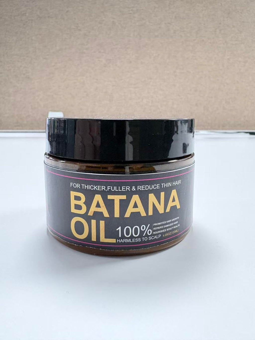 Qytin Batana Oil back view showing ingredients and instructions