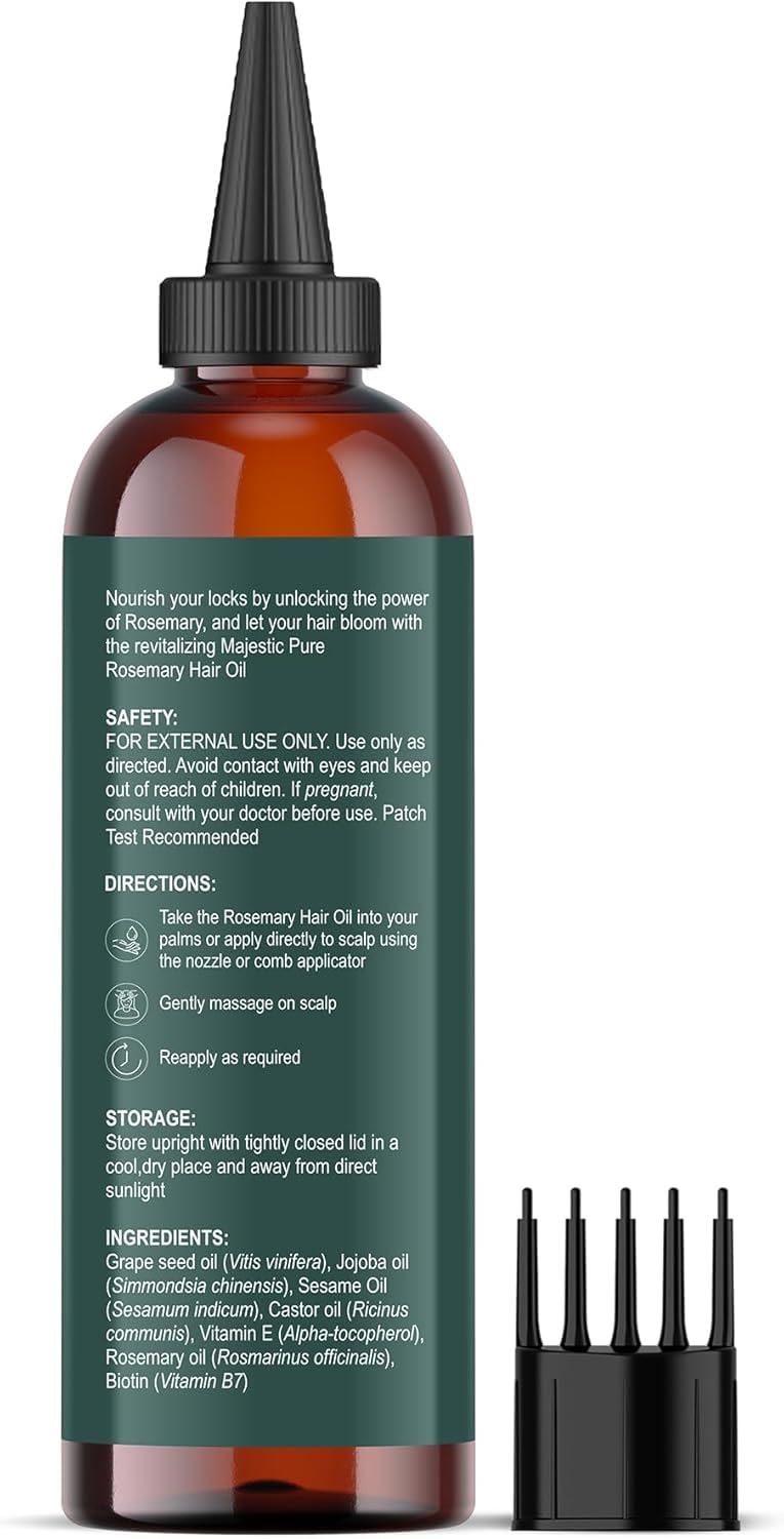 Majestic Pure hair oil bottle next to natural rosemary sprigs