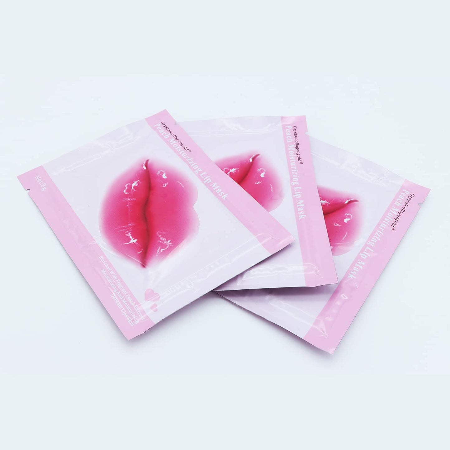 Complete thirty pair set of Miniling eye and lip masks spread out to display individual foil packaging.