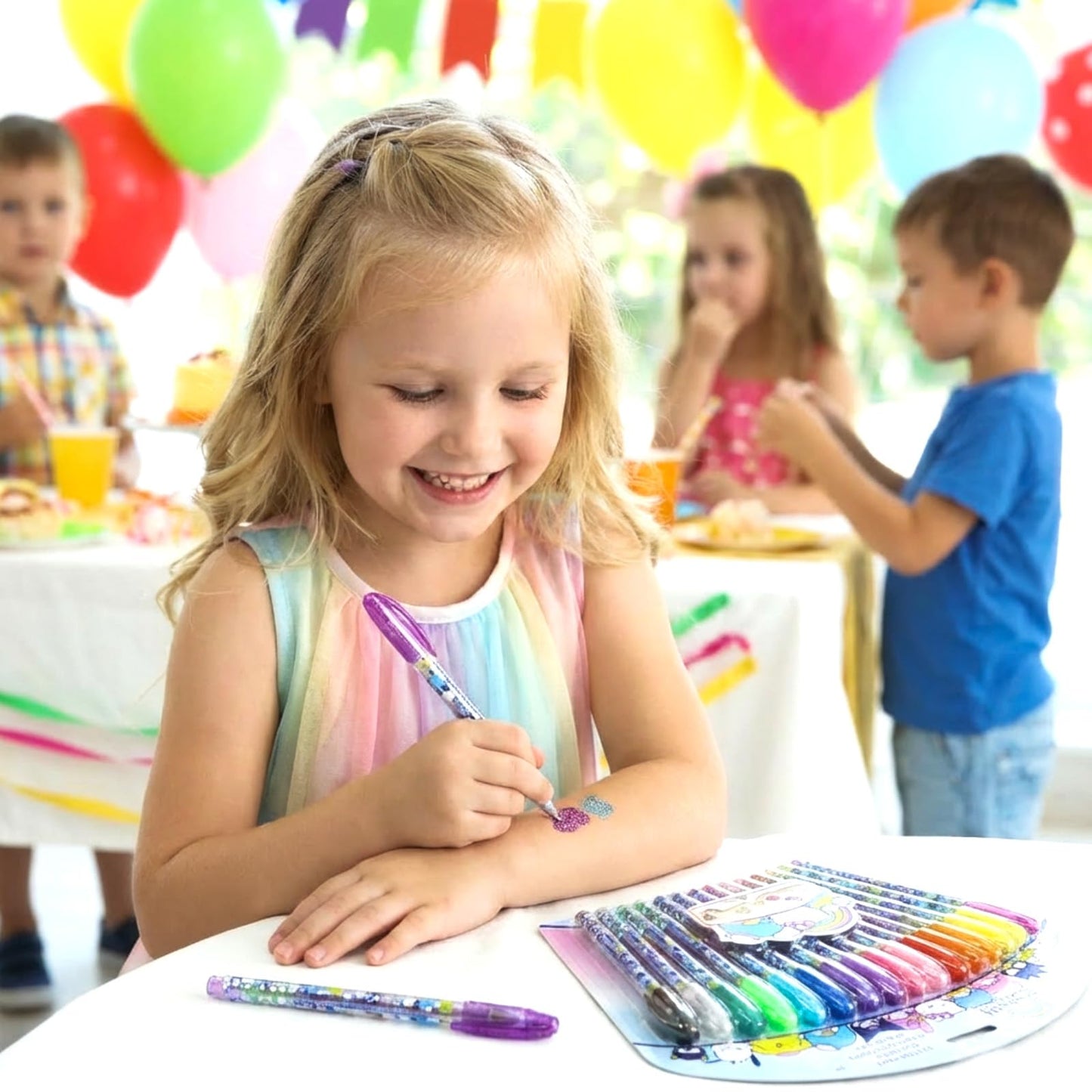 Children using washable glitter body pens during a dress up party