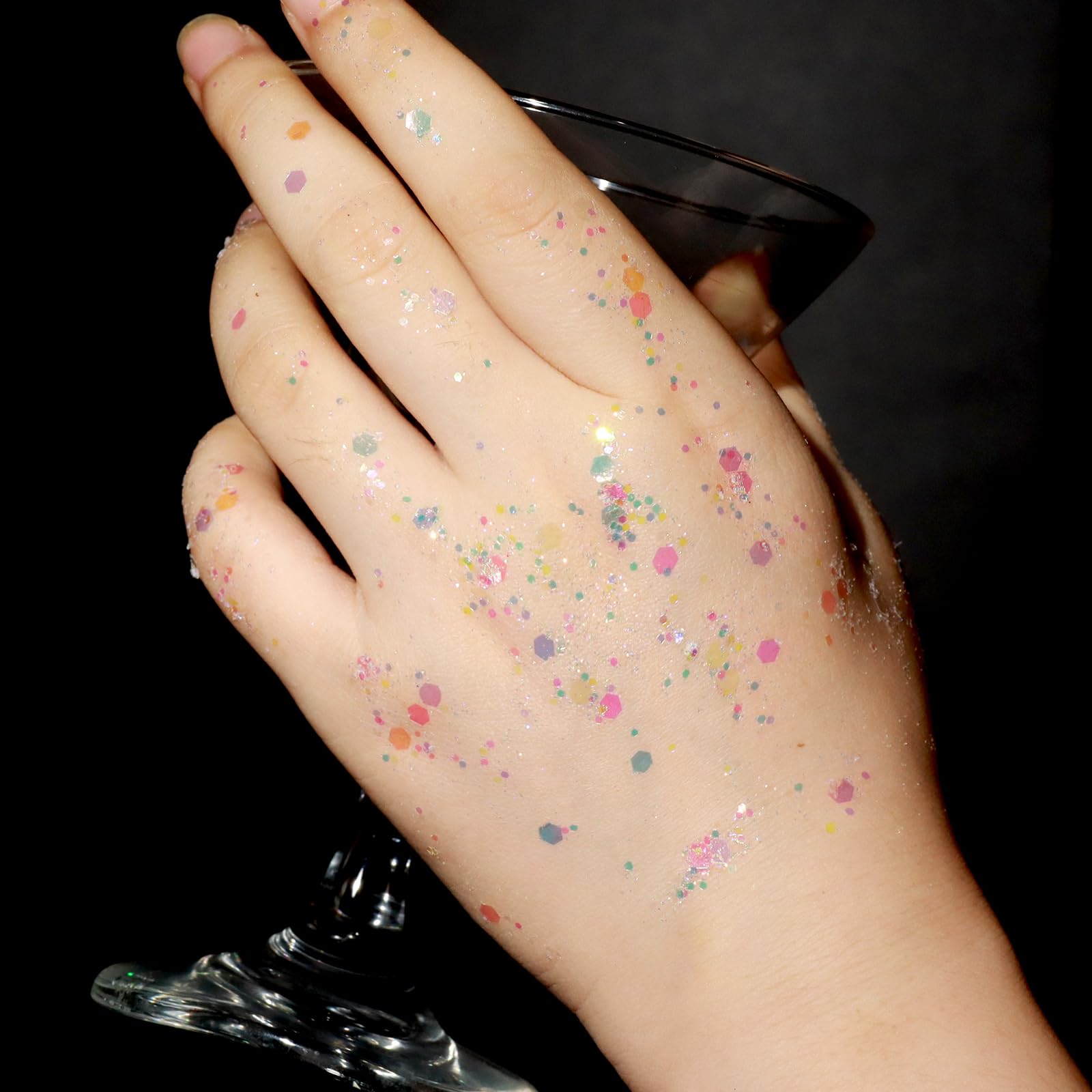 Water-soluble chunkier body shimmer being wiped away cleanly with a damp cosmetic tissue.