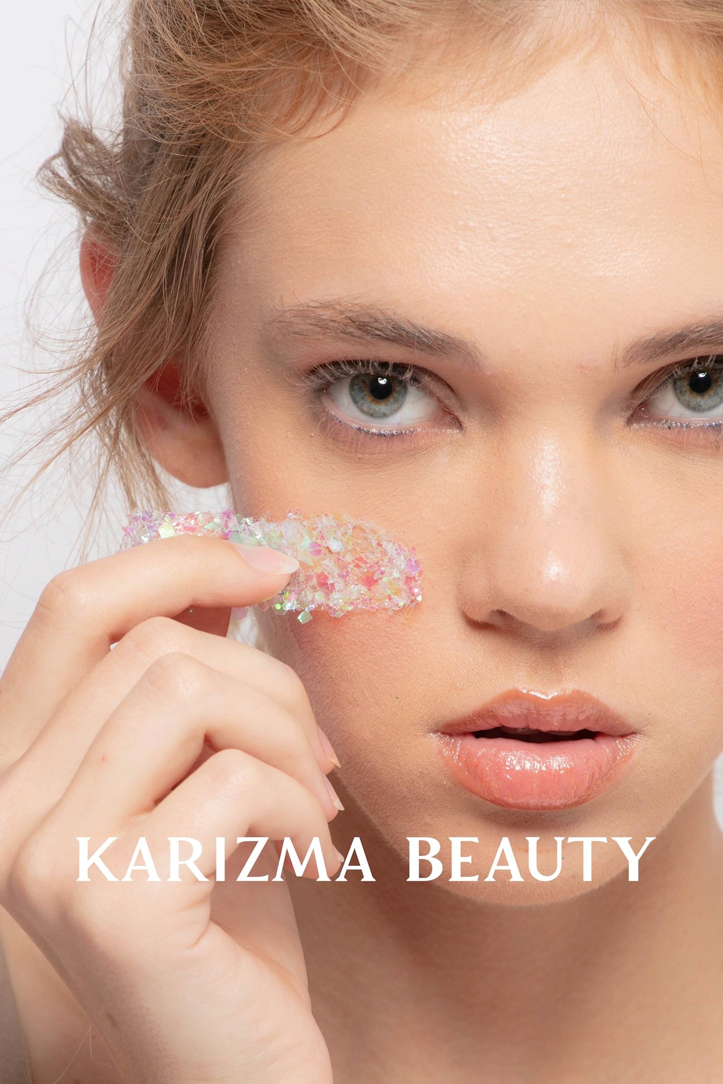 Peel off glitter primer gel tube showing the clear adhesive formula.
