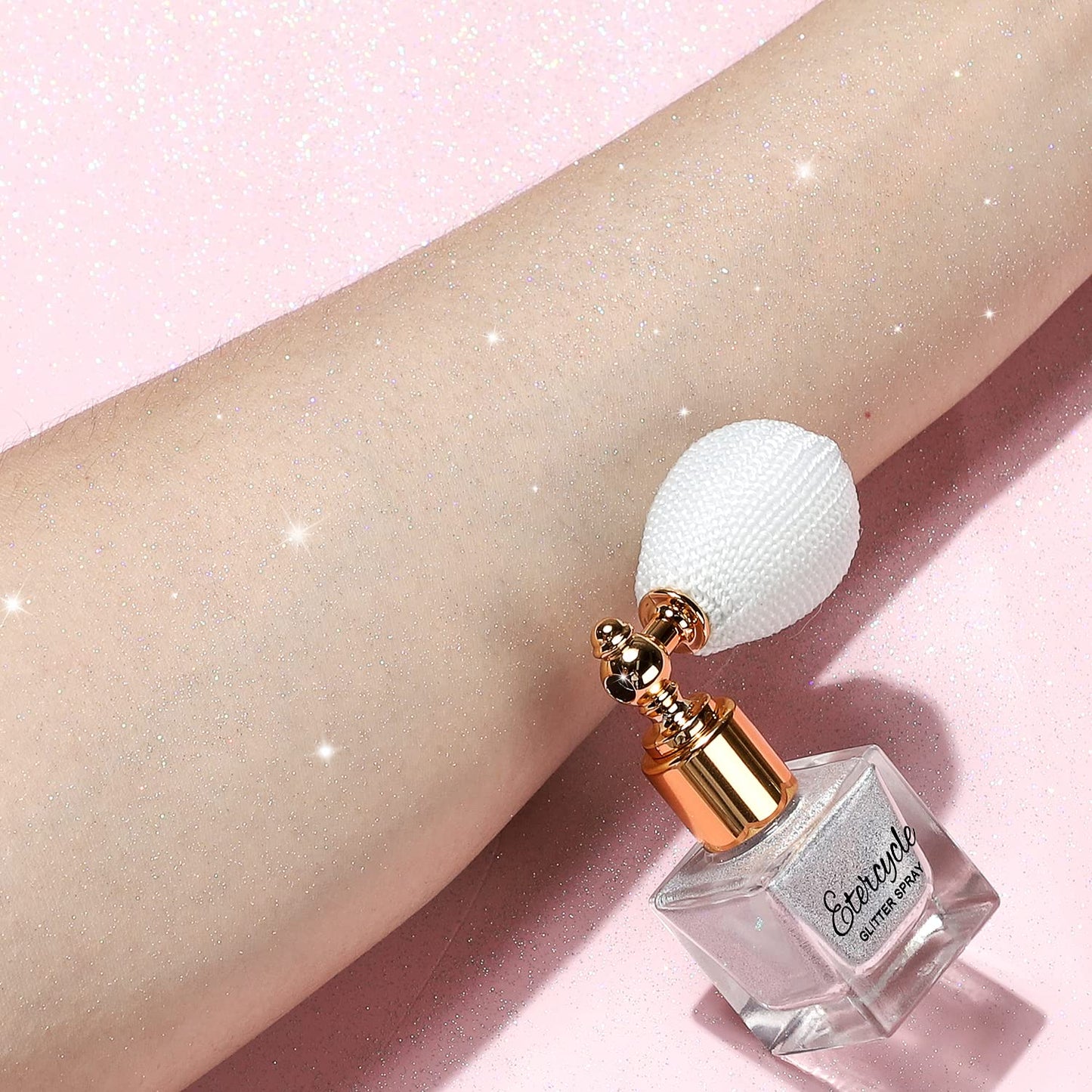 Lightweight silver sparkle powder applied on clothes and arm showcasing the holographic light catching effect.