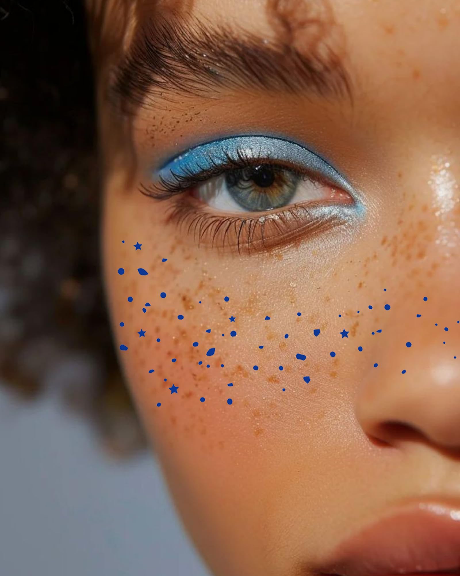 Waterproof star freckles face gems sheets showing eight distinct temporary gold tattoo designs.
