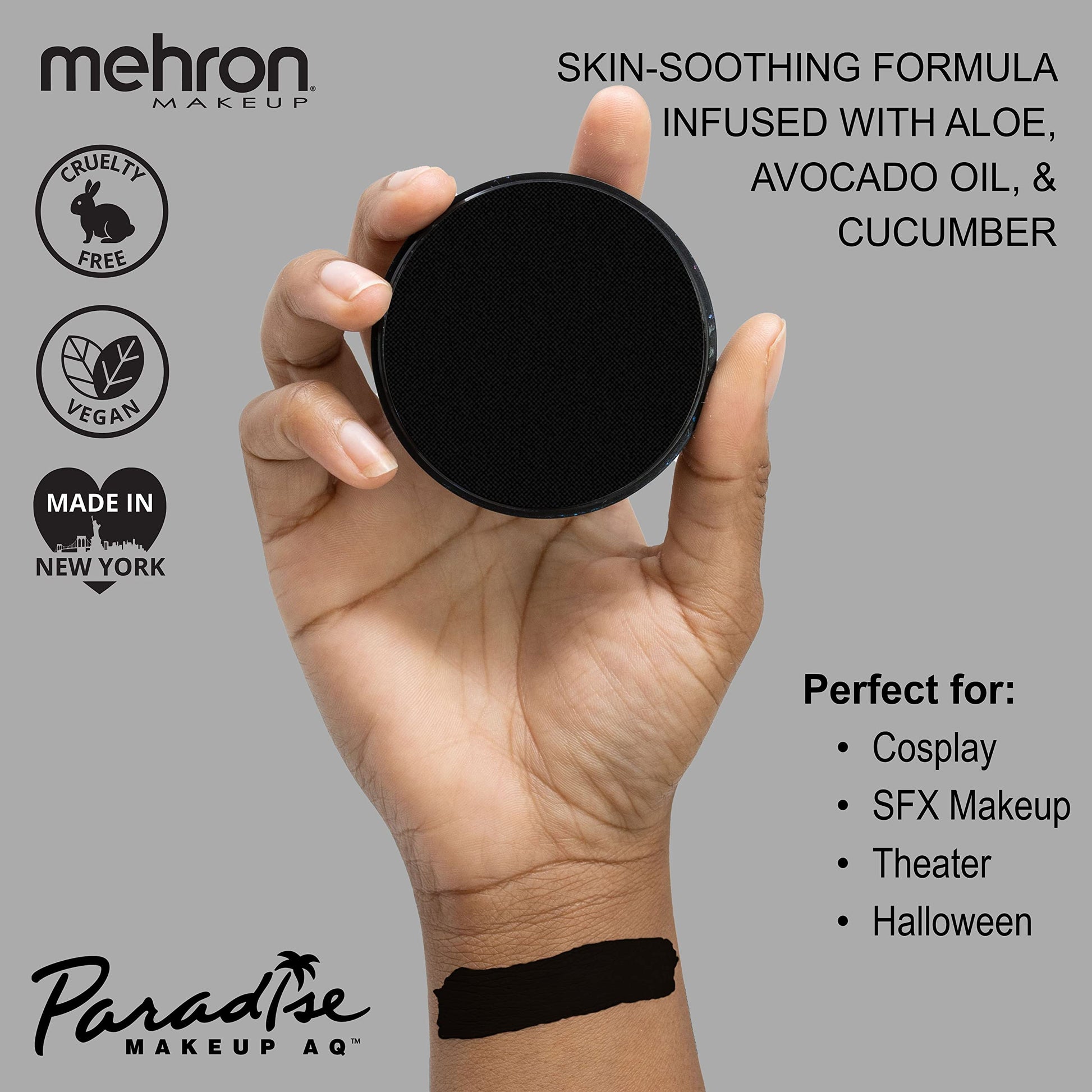 Mehron water activated professional black face paint cake open container displaying matte texture