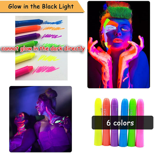 Ausbond UV fluorescent body paint sticks glowing brightly under an ultraviolet blacklight source