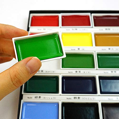 Open Kuretake traditional Japanese watercolor set revealing twenty four large color pans