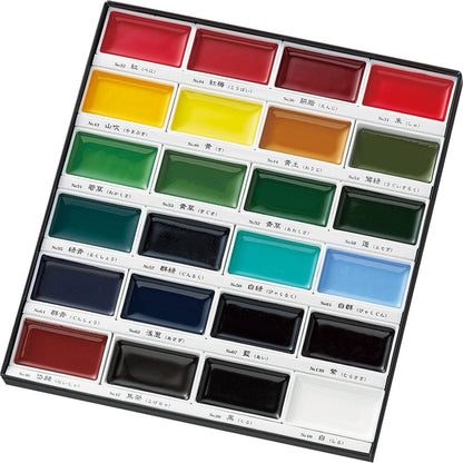 Authentic Kuretake solid watercolor paint set with protective sheet and color chart visible